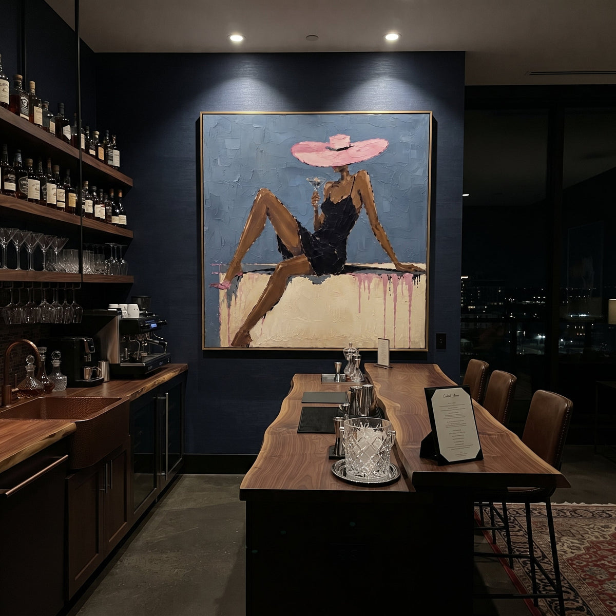Pink Hat Blue Lounge Figure focuses on seated woman in black dress with long legs, pink wide hat, blue wall, pale sofa ledge, and pink drip marks. The composition is built from the exact pose, clothing shape, accessories, furniture, animal form, shoreline, palm shape, surfboard, or table arrangement visible in this artwork, so the image reads as a specific modern figurative painting rather than a generic decorative abstract. The blue; pink; black palette gives the piece its main atmosphere