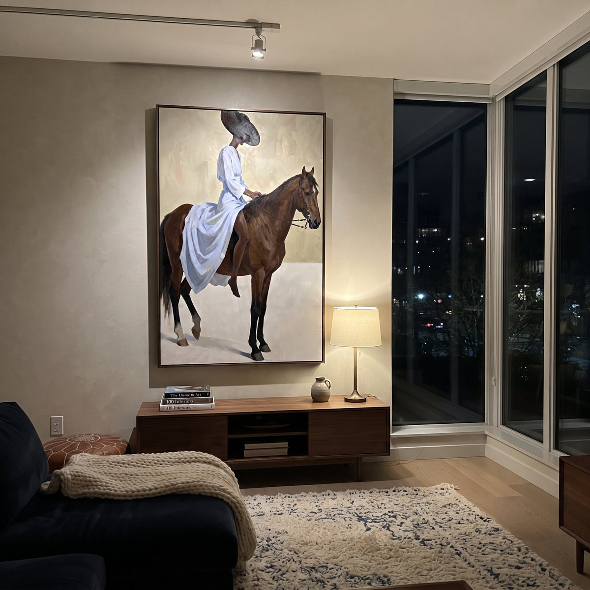 Blue Dress Horse Ride focuses on woman in pale blue dress riding brown horse across bright white ground. The composition is built from the exact pose, clothing shape, accessories, furniture, animal form, shoreline, palm shape, surfboard, or table arrangement visible in this artwork, so the image reads as a specific modern figurative painting rather than a generic decorative abstract. The blue; brown; cream palette gives the piece its main atmosphere, while smaller dark and light accents define